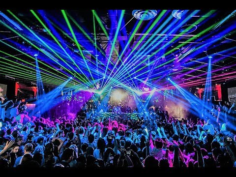 Packed dance floor with party lights